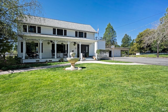 view of front of home with a front yard and a porch