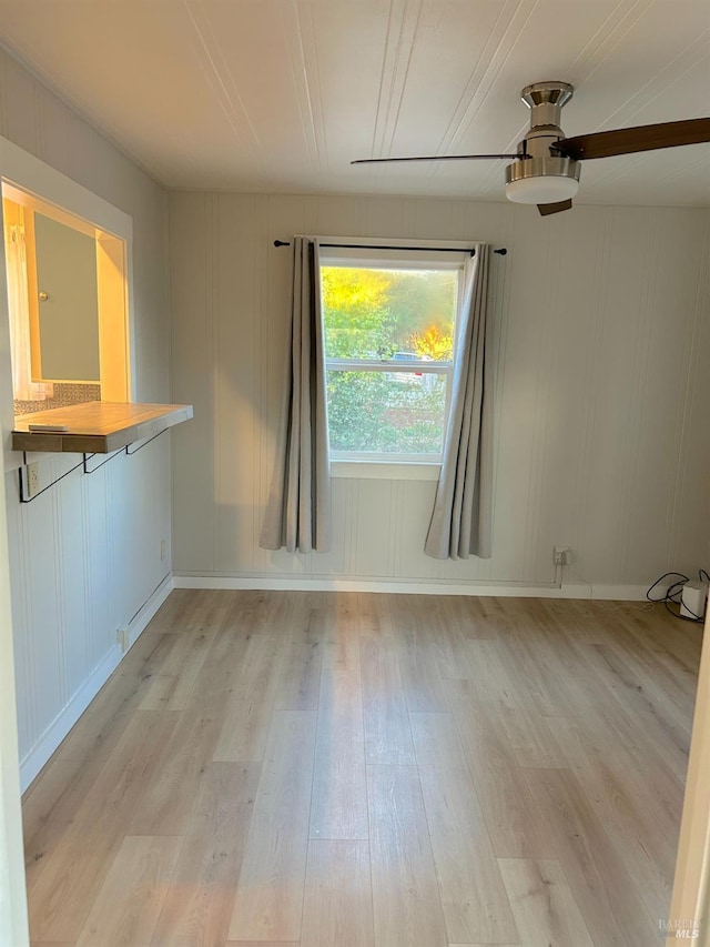 spare room featuring ceiling fan and light hardwood / wood-style floors