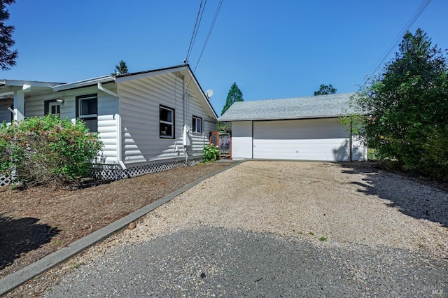 ranch-style home featuring a garage