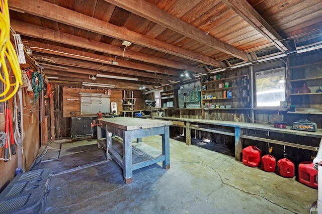 interior space with a workshop area and concrete floors