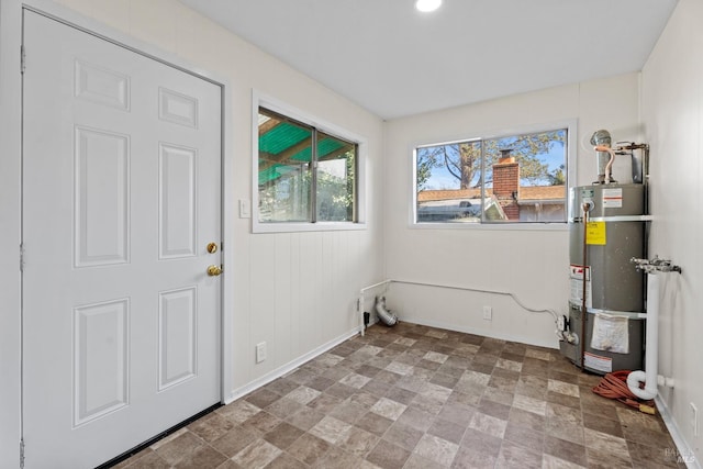 washroom featuring hookup for an electric dryer and secured water heater