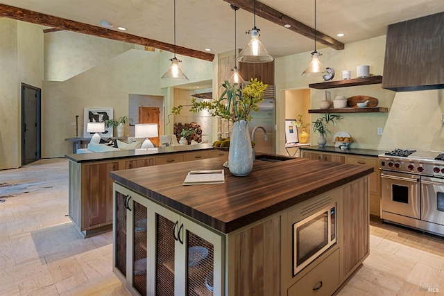 35 Forest Ln, Napa, CA 94558 - kitchen featuring wooden counters, a sink, beamed ceiling, a center island with sink, and appliances with stainless steel finishes