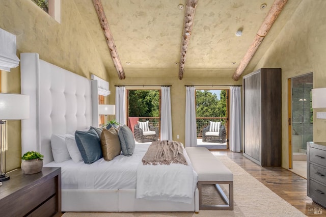 35 Forest Ln, Napa, CA 94558 - bedroom with beam ceiling, access to exterior, wood finished floors, ensuite bath, and high vaulted ceiling
