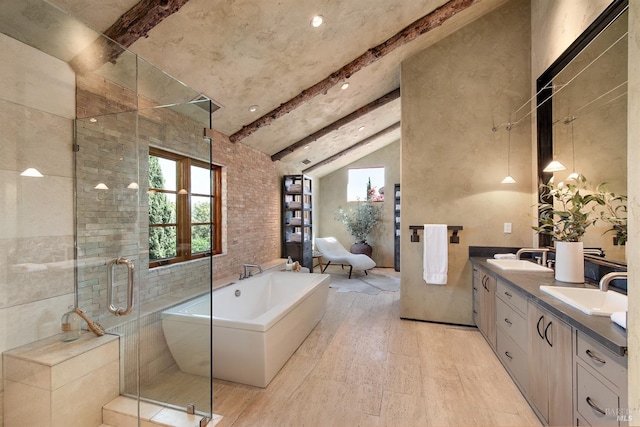 35 Forest Ln, Napa, CA 94558 - bathroom with wood finished floors, vaulted ceiling with beams, a sink, a soaking tub, and a stall shower
