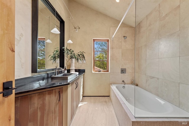 35 Forest Ln, Napa, CA 94558 - full bathroom with a wealth of natural light, lofted ceiling, vanity, and tiled shower / bath combo