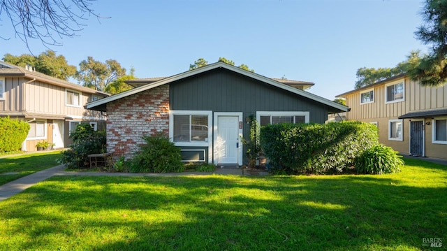 view of front of home with a front yard