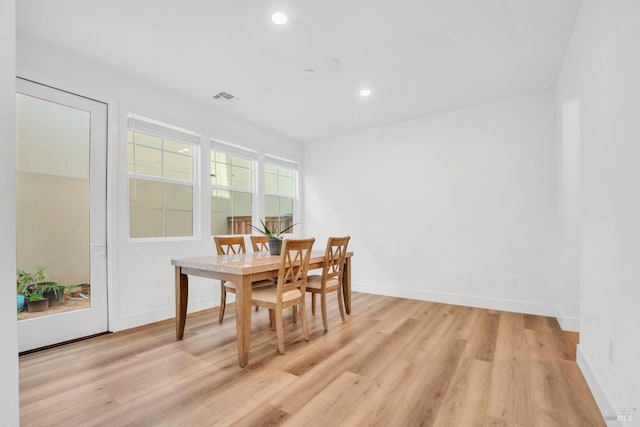 dining room with light wood-type flooring