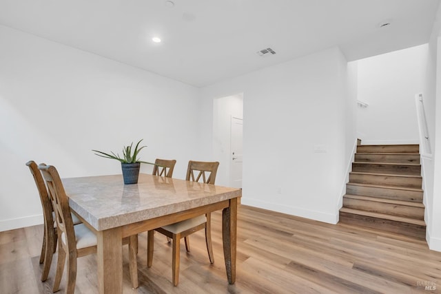 dining space featuring light hardwood / wood-style flooring