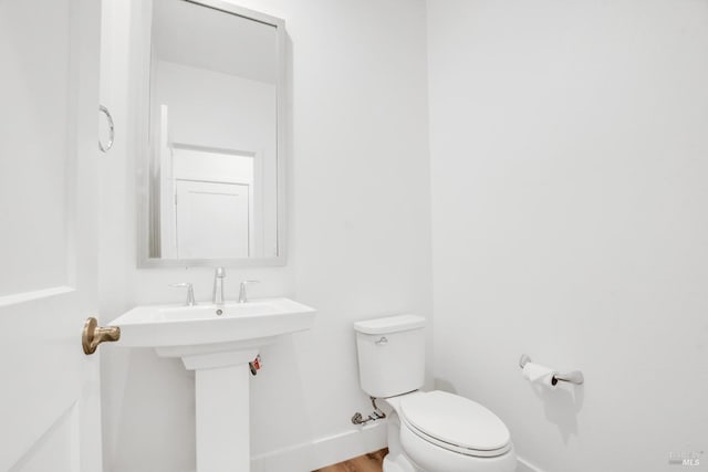 bathroom with toilet and sink