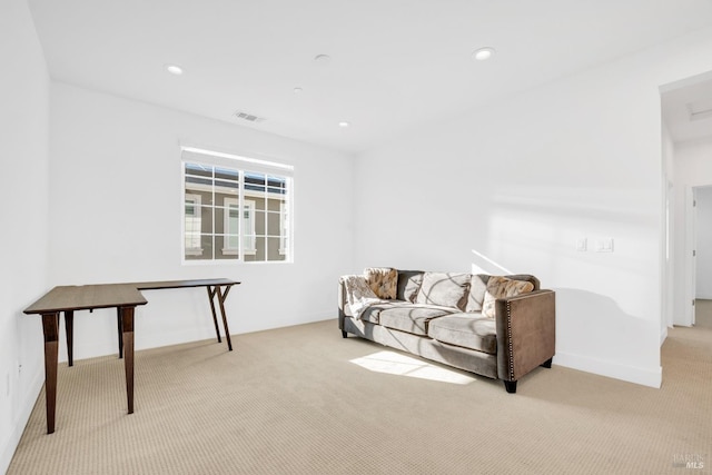 living room featuring light carpet