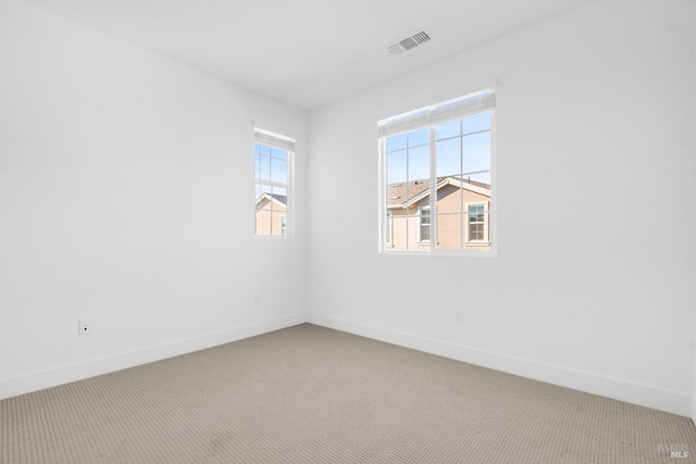 unfurnished room featuring carpet