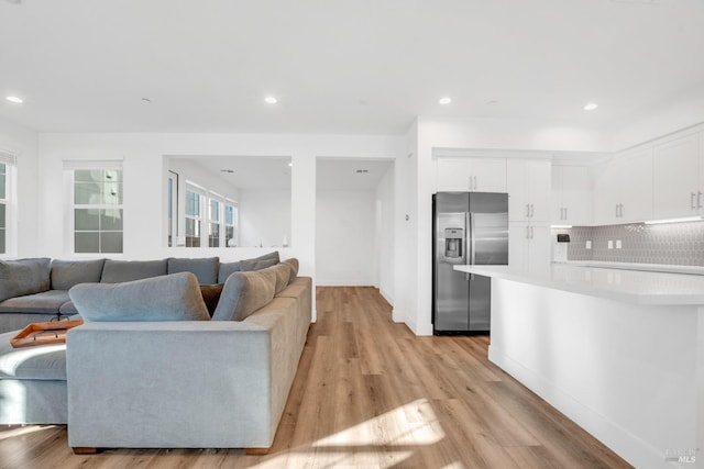 living room with light hardwood / wood-style floors