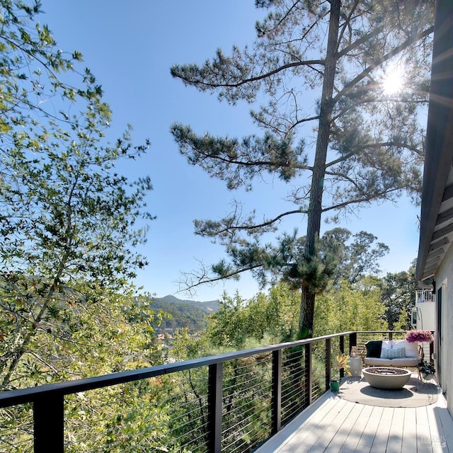 deck with an outdoor fire pit