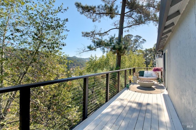 deck with an outdoor fire pit