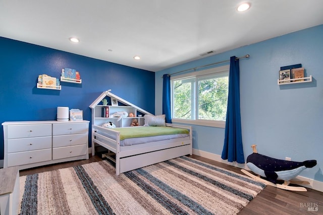 bedroom featuring wood-type flooring