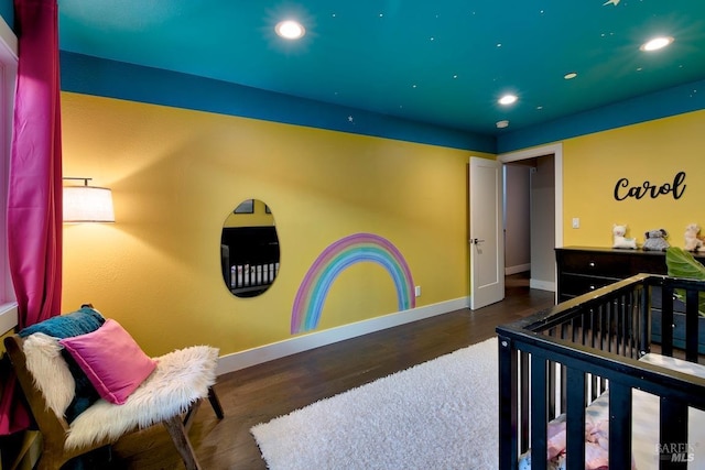 bedroom with dark wood-type flooring