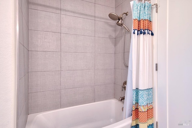 bathroom with shower / tub combo with curtain