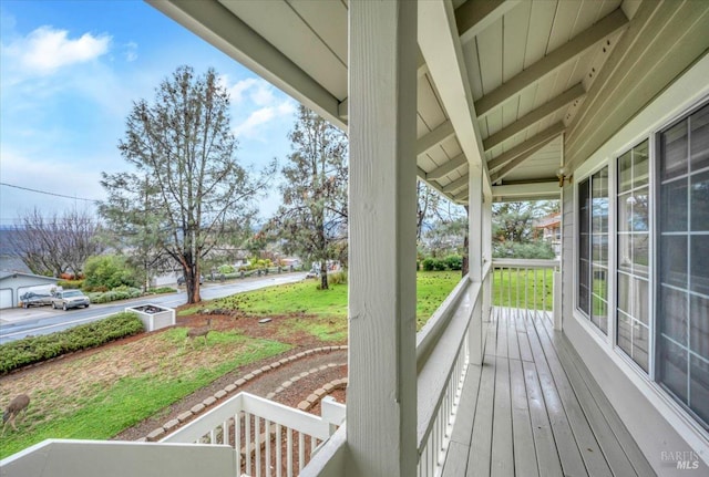 wooden deck featuring covered porch