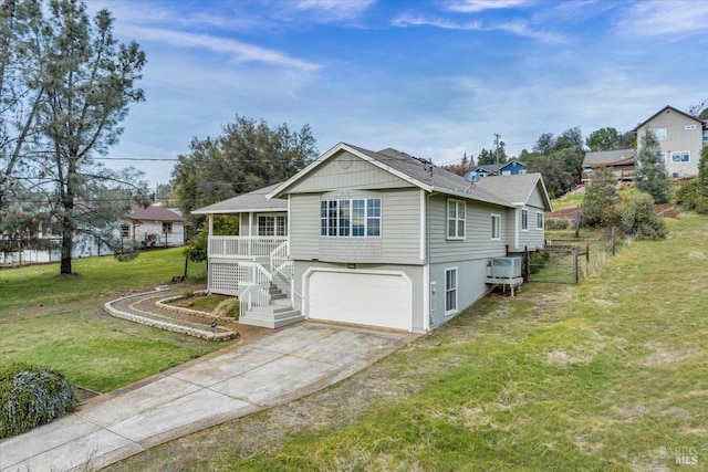 view of front of house with a front yard and a garage