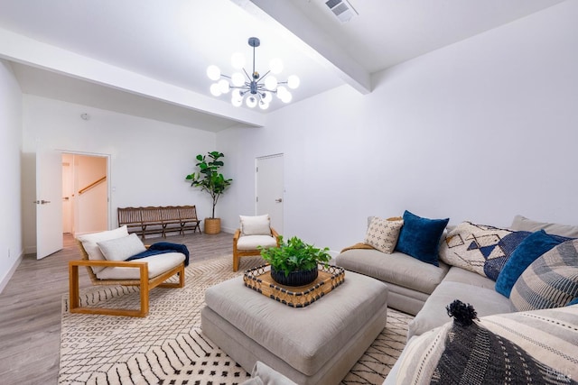 living room with an inviting chandelier, beam ceiling, and light hardwood / wood-style floors