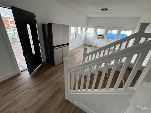 staircase featuring hardwood / wood-style flooring