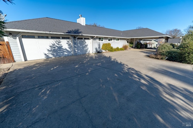 ranch-style house featuring a garage