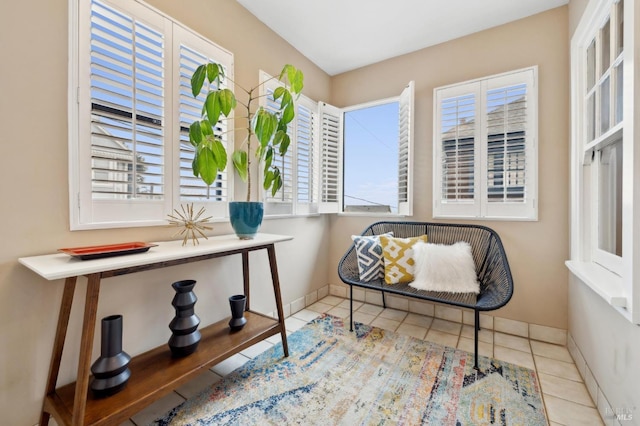 sitting room with light tile patterned flooring