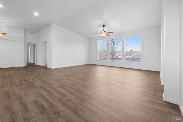 unfurnished living room featuring ceiling fan and wood-type flooring