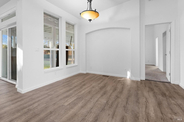 unfurnished dining area with hardwood / wood-style flooring