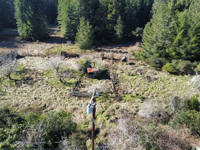 exterior space featuring a view of trees