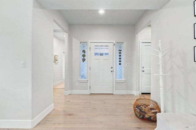 foyer entrance featuring light wood-type flooring