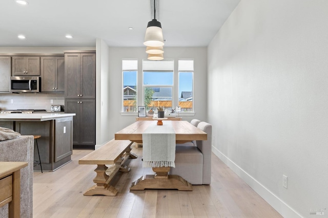 dining area featuring light wood-type flooring