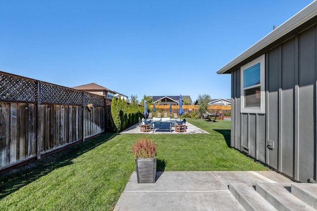 view of yard with a patio area and an outdoor living space