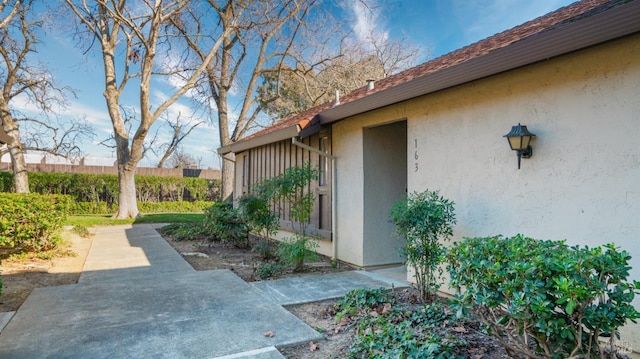 view of side of home featuring a patio area