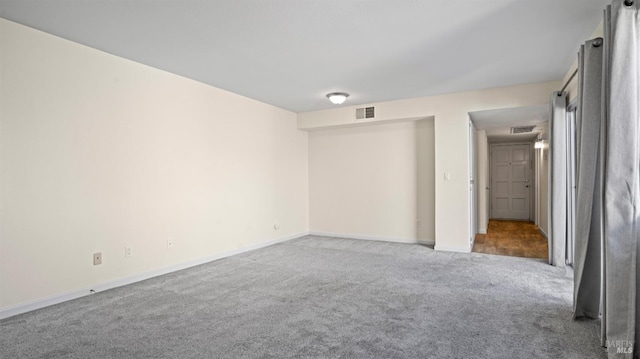 empty room with light colored carpet
