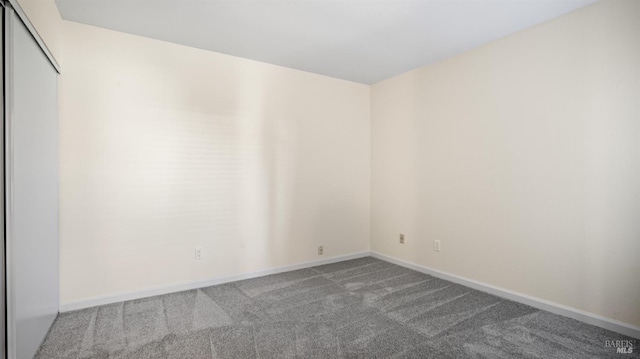 empty room featuring carpet floors