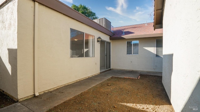 view of side of home with a patio