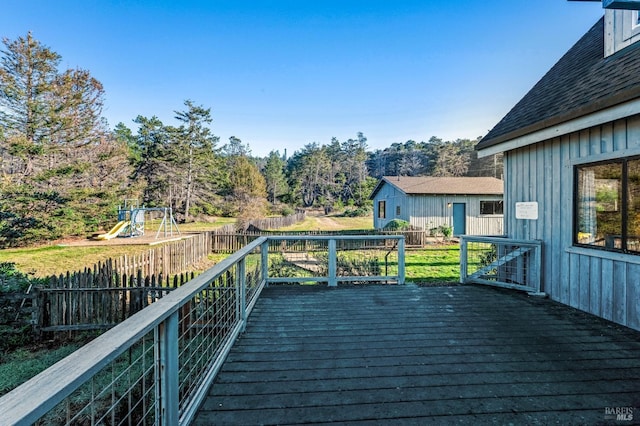 wooden terrace with a playground