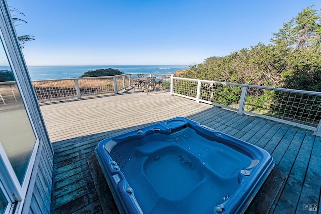 wooden terrace with a water view