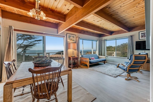 interior space featuring an inviting chandelier, wood ceiling, light hardwood / wood-style flooring, and beamed ceiling