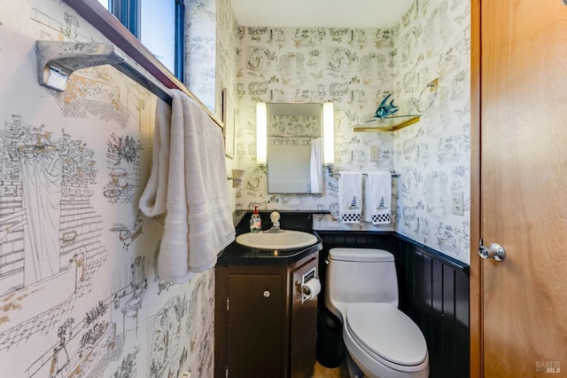 bathroom with toilet and vanity