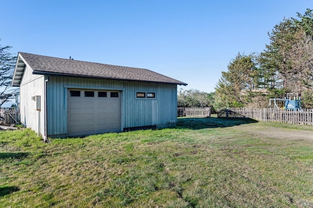 garage with a lawn