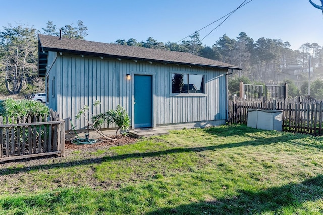 view of outbuilding featuring a yard