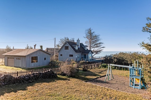 exterior space with an outbuilding and a playground