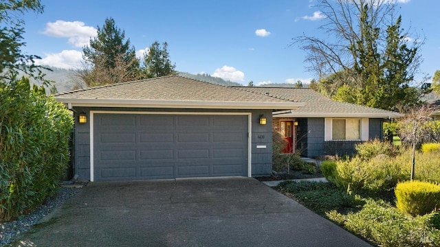 ranch-style home featuring a garage