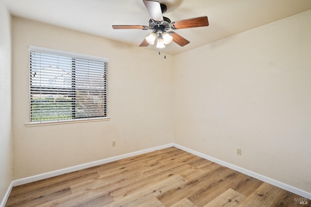 empty room featuring ceiling fan and light hardwood / wood-style flooring