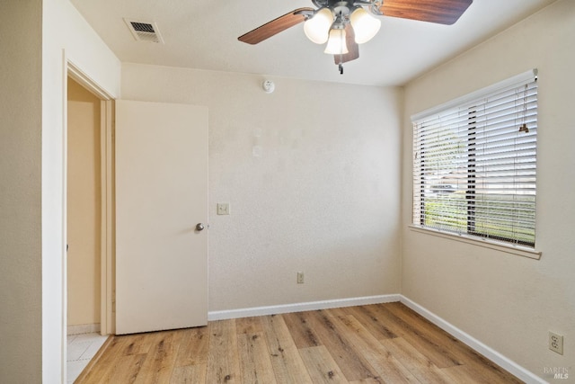 spare room with ceiling fan and light hardwood / wood-style flooring