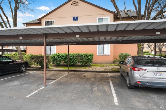 view of parking / parking lot with a carport