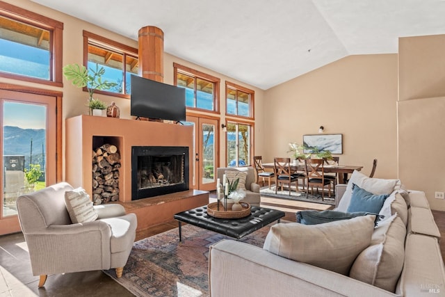 living room with lofted ceiling and a mountain view