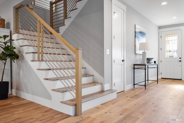 staircase featuring hardwood / wood-style floors